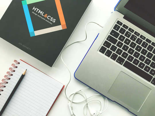 laptop and notebook - web design vs web development cover image